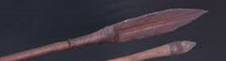 Metal spearhead with smaller stone small spearhead.